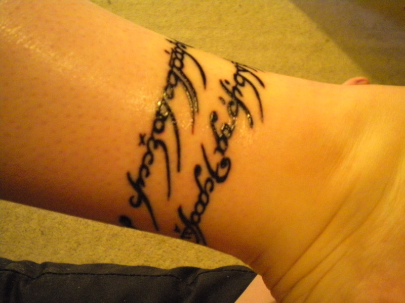 LOTR  Elvish tattoo down spine by Benjamin Jenness TattooNOW